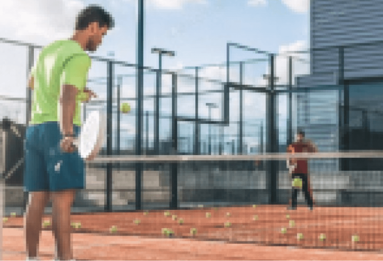 Dunes Racquet Club building exterior with logo